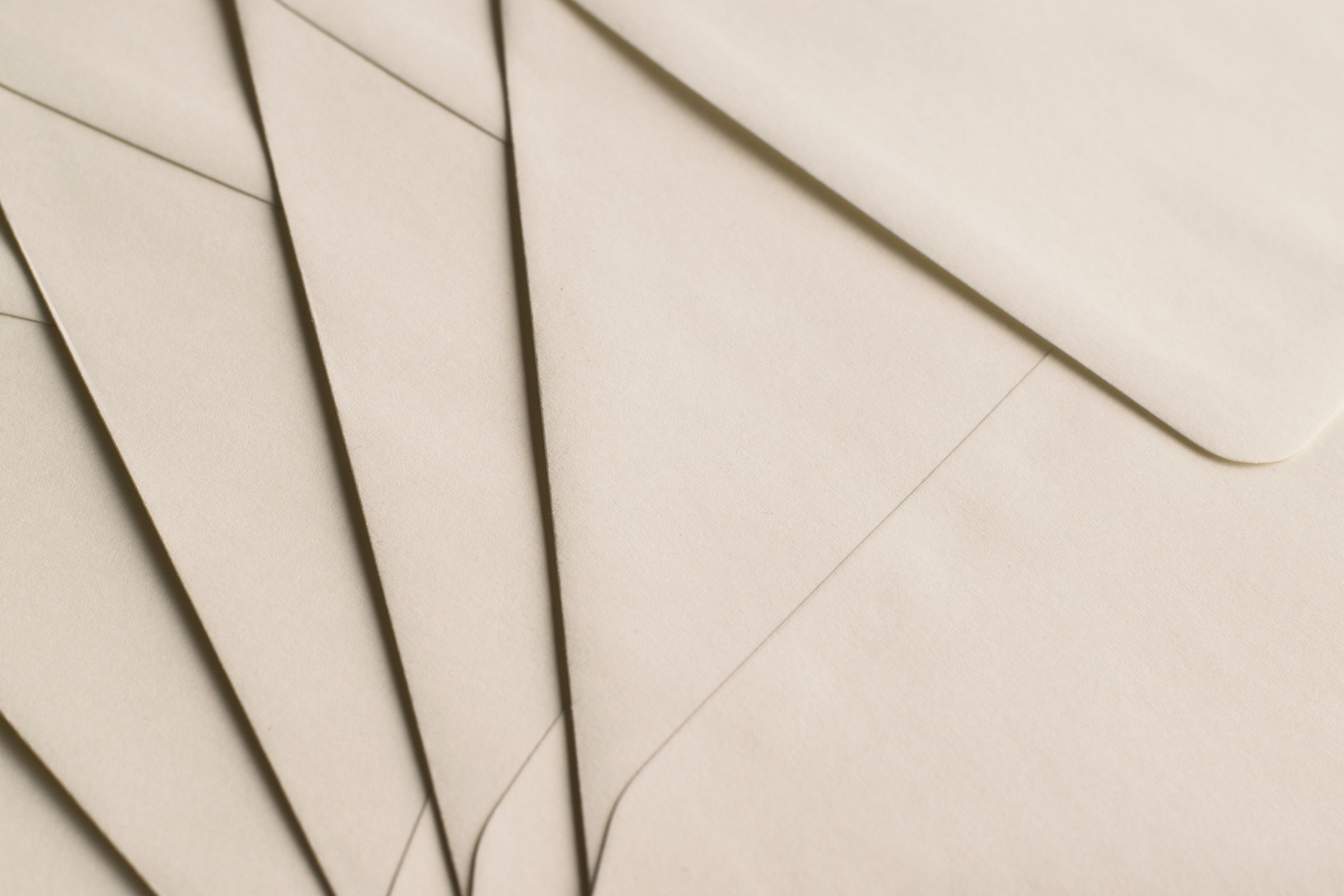 Fanned cream envelopes.